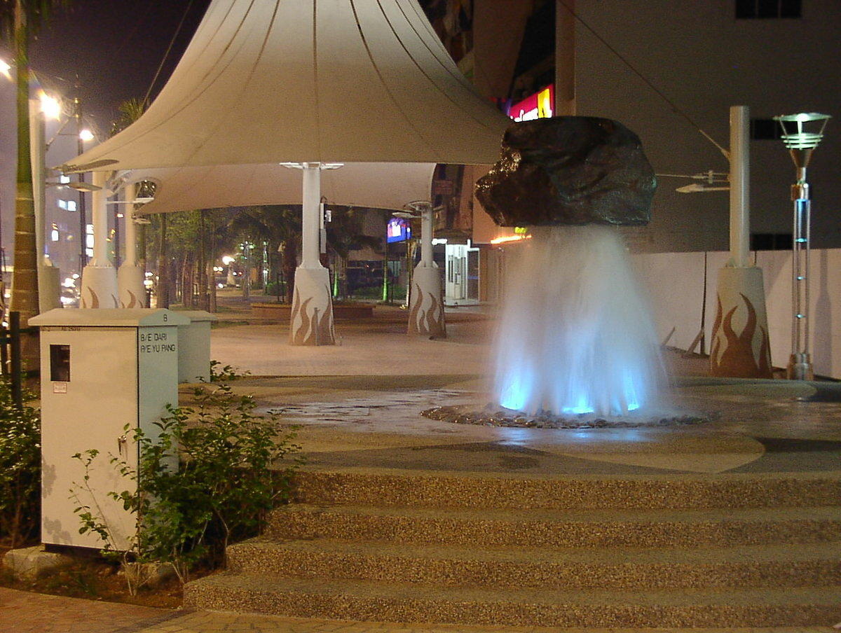 Fountain with rock on top.