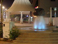 Fountain with rock on top.